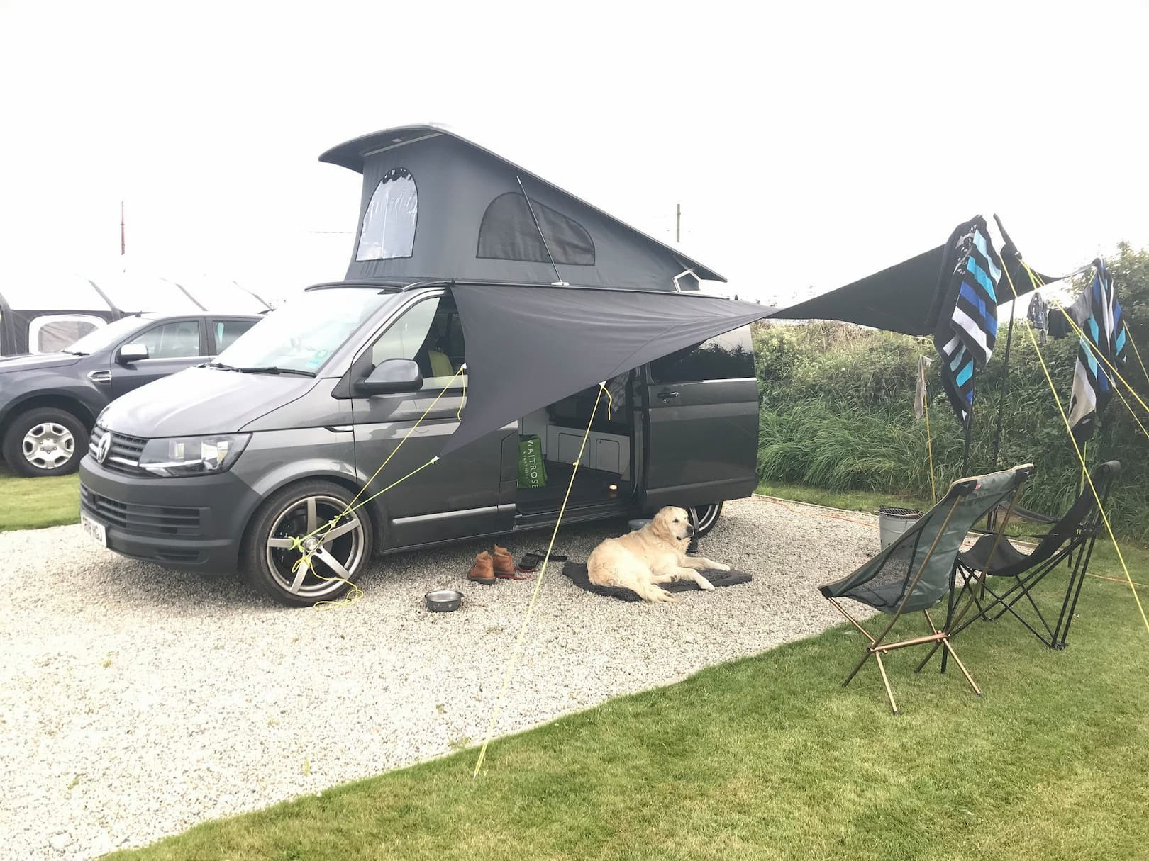 A customer uses their Vamoose Multirail to secure a sun shade to whilst camping!